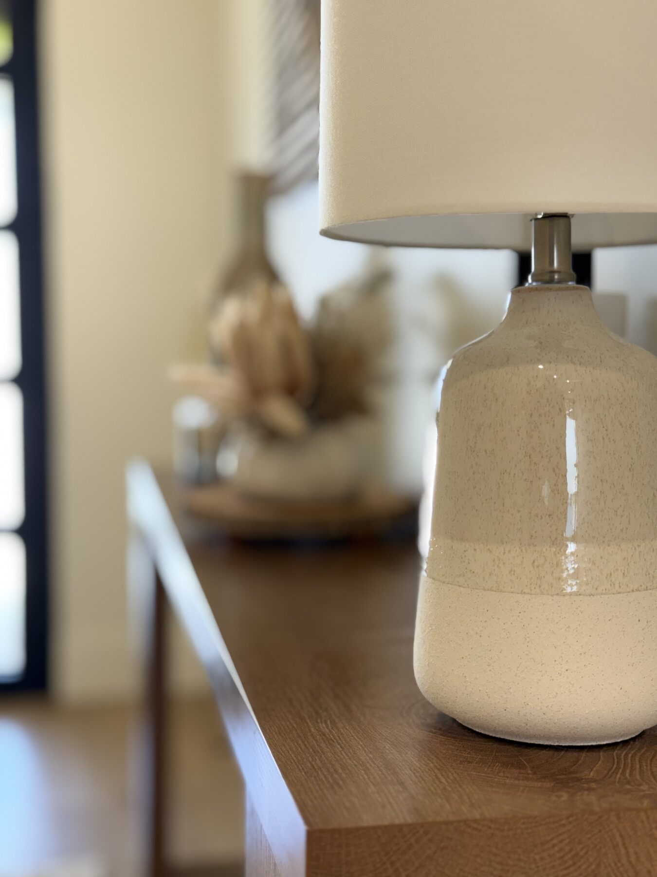 Ceramic lamp detail on a wood console